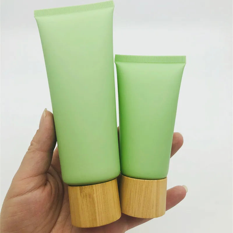 In Stock Cosmetics Soft Tube Matte Green Face Cleaner Hand Cream Empty clear Tube with Bamboo Cap 50g 100g 200g