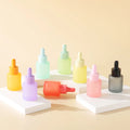 Wholesale Serum Cosmetic Packaging 20ml Frosted pink Blue Red Black Flat Essential Oil Glass Dropper Bottle