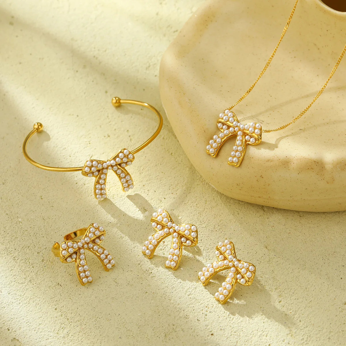 Trendy 4pcs /Set Women Pearl Inlay Stainless Steel Bowknot Necklace Earrings Bangle Ring Kit Pearl Party Gift