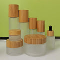 Stock Eco-friendly Wood Cap Essential Oil Bottle 15ml 30ml 50ml 100ml 120ml Frosted Glass Lotion Spray Pump Bottle Cream Jar Set