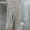 Factory Direct Price Rice Shape Natural Freshwater Pearls String High Gloss Pearl Stand