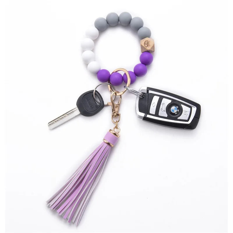 Wholesale Trendy Silicone Beads Lady Bracelet with PU Tassel Keychain Metal Accessories