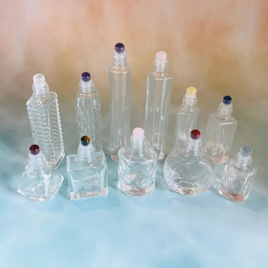 High Quality Wholesale Silk Screen Printed Roll on Glass Bottles 5ml 6ml 8ml 10ml Clear Swirled Special Shape Gold Cap Cosmetic