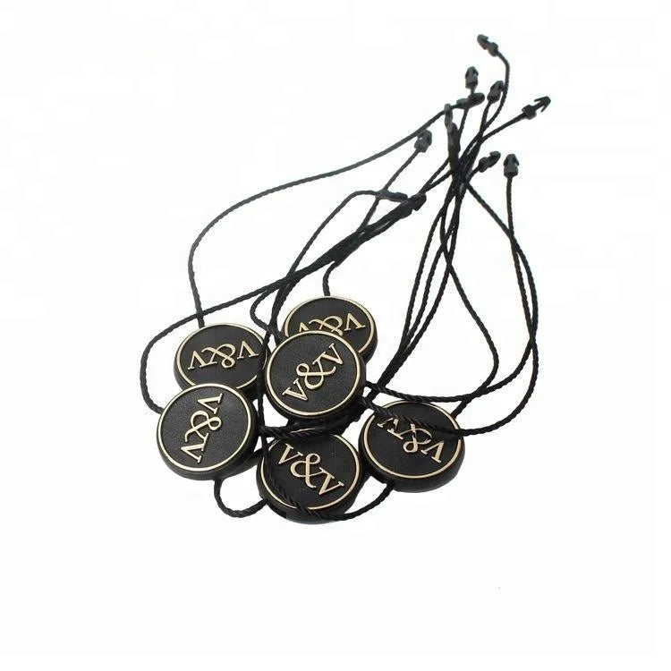 Customized Hot Stamping 3D Embossed Logo Injection Black Plastic Hang Tag Seal Strings for Clothing