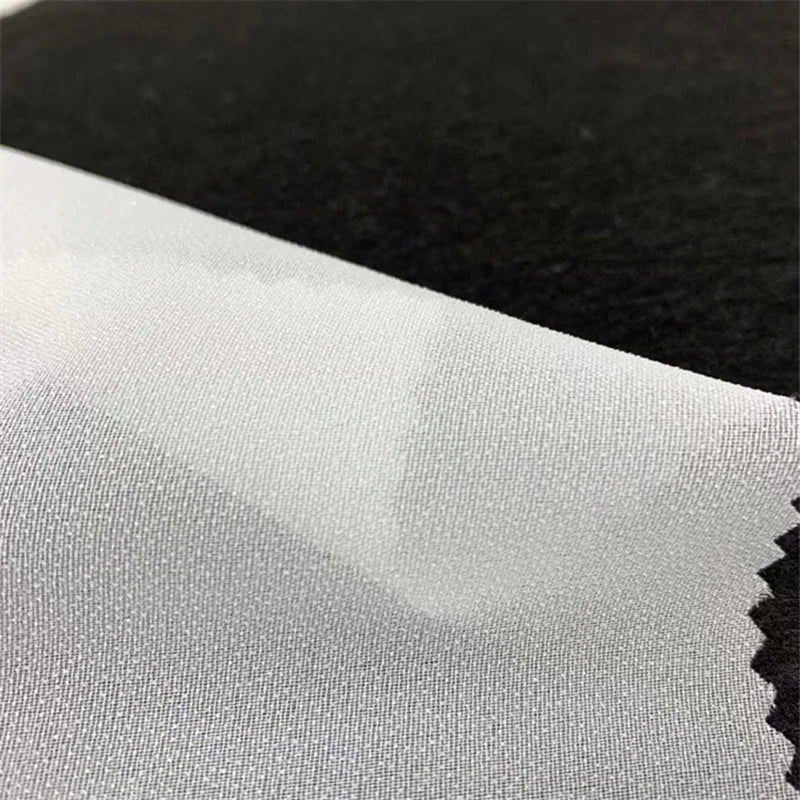 XINGYAN 100% Polyester 30D Woven Voile White Fusible Elastic Garment Interlining Fabric PA Coated 30gsm 100 Meters Per Roll