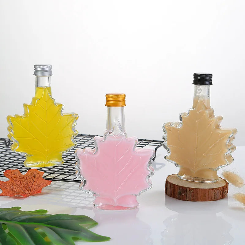 Wholesale 50ml 100ml Small Maple Leaf Shaped Clear Empty Glass Wine Bottle for Spirit Vodka Packaging
