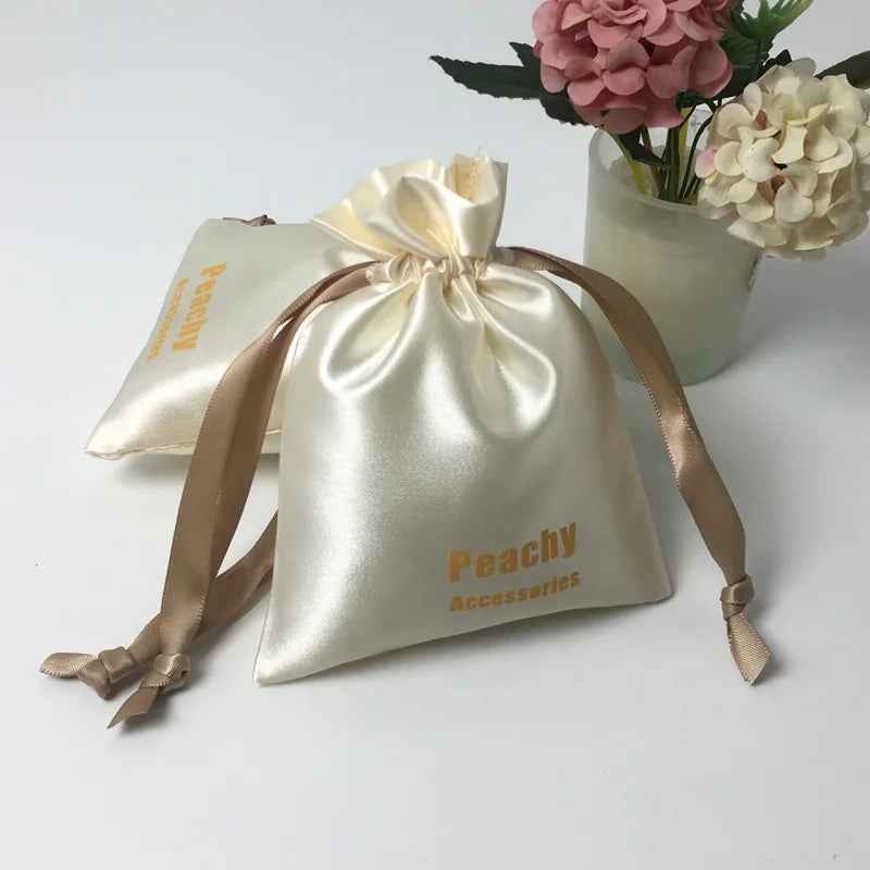Custom Beige Satin Drawstring Dust Bags with Ribbon Waterproof Simple Logo Printed Gift Cosmetic Bags for Grocery Use
