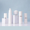 High Quality Custom Logo Empty Cylinder Cream Lotion Spray Bottle with White Caps Airless Plastic for Skin Care Serum & Shampoo