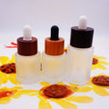 Flat Shoulder clear Glass Bottle Set Cosmetic with Dark Black Wooden Lid