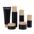 30g 50g Matte Black Cream Jar 1oz 30ml 60ml 100ml Matte Black Glass Spray Pump Lotion Bottle With Wood Grain Cap for Cosmetics