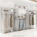 Showroom Design Modern Stainless Steel Women Dresses Shop Special Clothes Rack Glossy Gold Custom Logo Clothes Display Rack MegaBDM