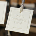 Custom Garment Hangtag with Gold Foil Logo China's Debossed Cardboard Paper Printing for Clothing String Attached
