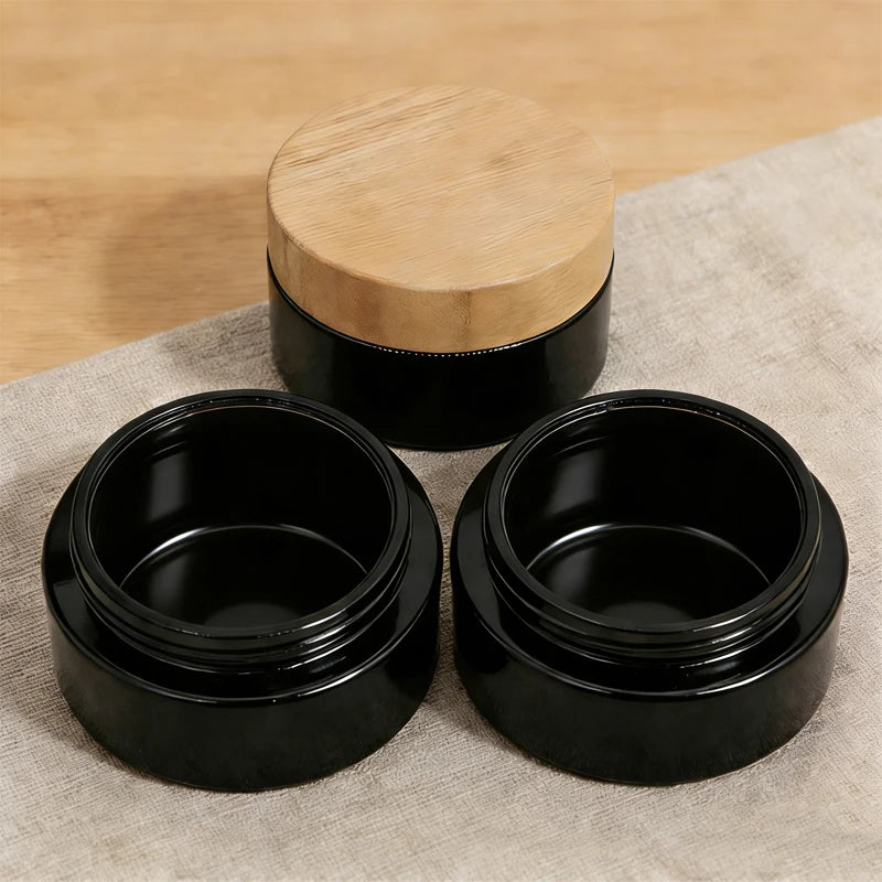 Custom Empty Bamboo Cosmetic Packaging Jar 30ml 50ml 100ml Black Frosted Wooden Glass Jar With Bamboo Lid