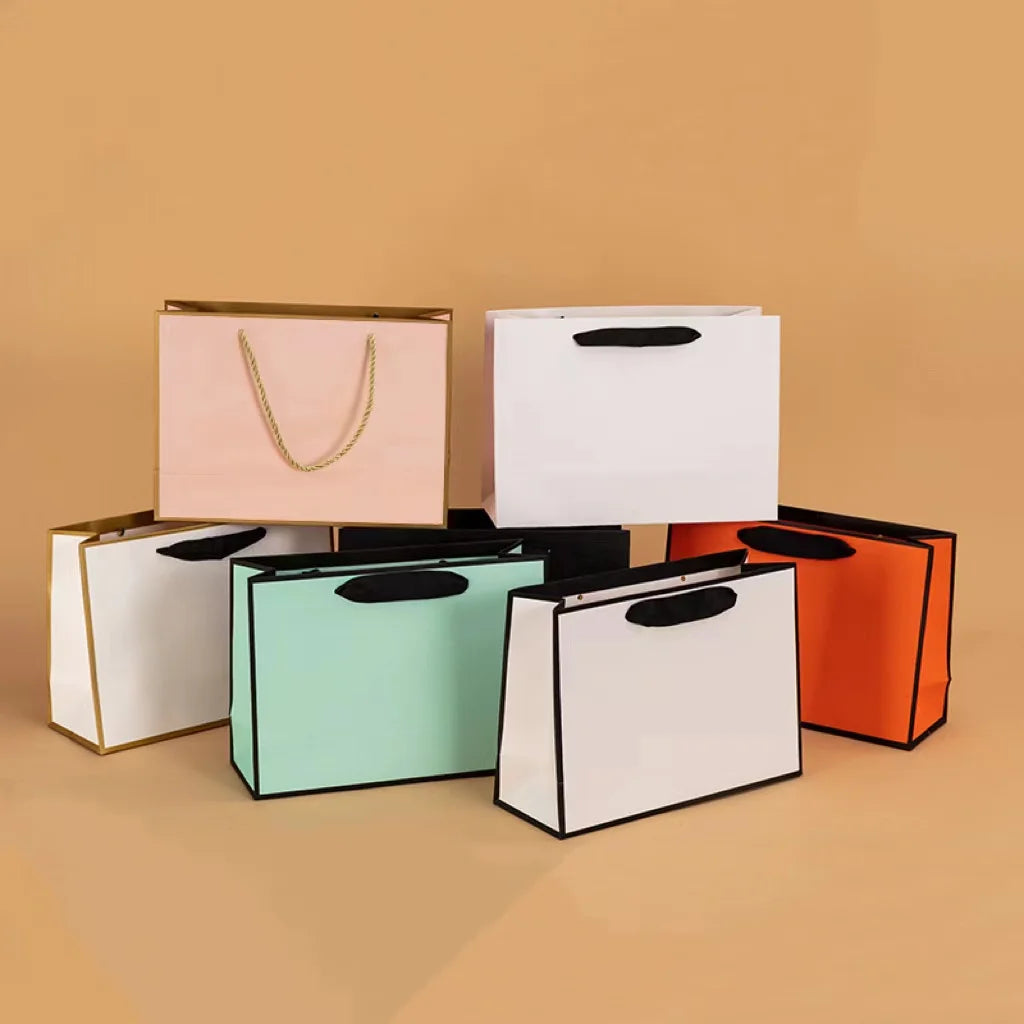 Wholesale Custom Luxury Gift Cosmetic Clothing Shoes Shopping Cardboard Paper Gift Bags With Handles