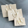Custom Luxury Beige Clothes Store Retail Packaging Gift Carry Bags Boutique Shopping Paper Bags with Your Own logo