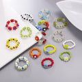 Wholesale Korea Style Fancy Small Cute Colored Plastic Seed Rice Bead Ring Elastic Adjustable Daisy Flower Ring for Women Ladies