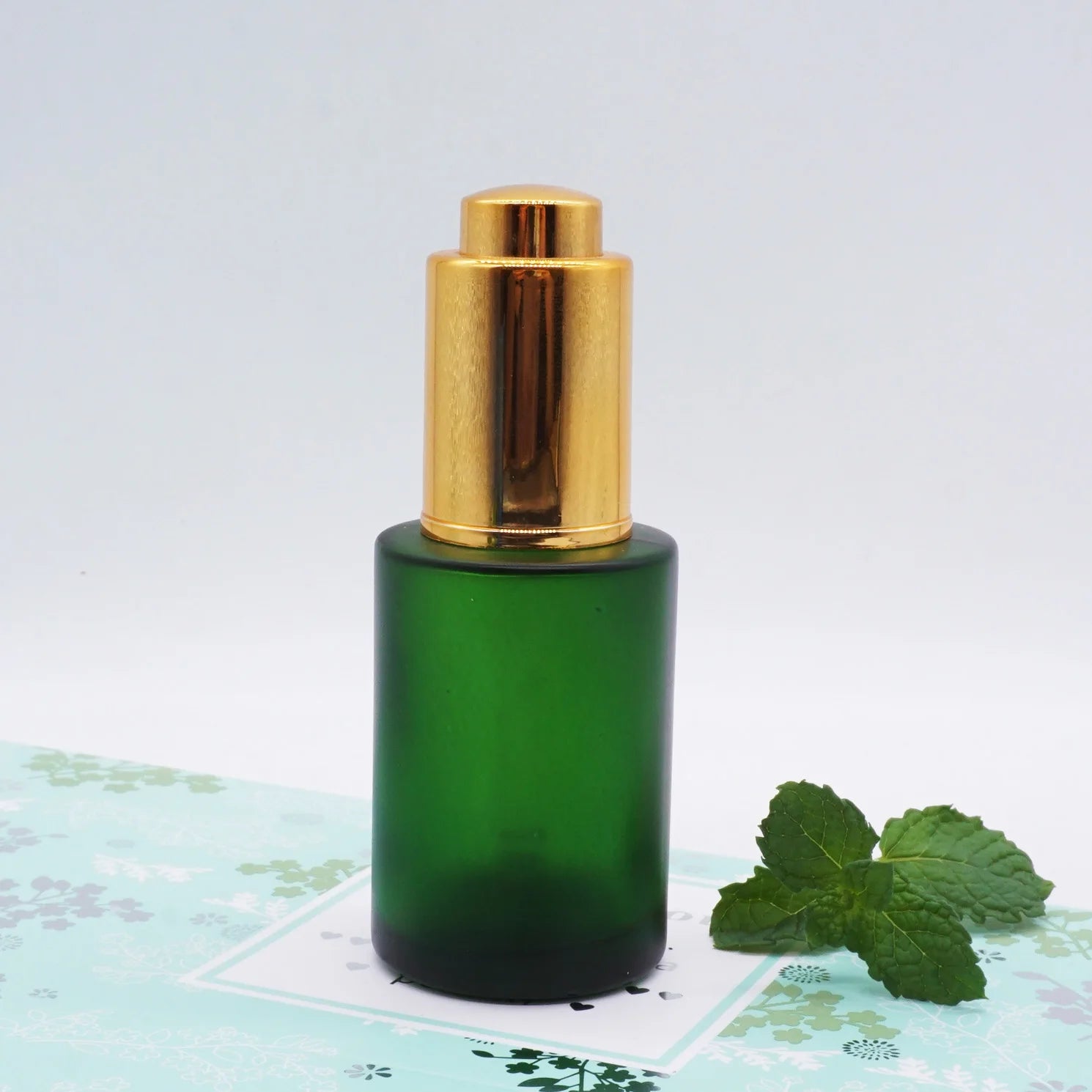 30ml Flat Shoulder Green Glass Dropper Bottle with Gold Push Button
