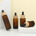 Jingtuo Supplier Oil Glass Serum Dropper Bottle Glass Bottle With Wood Grain Cap Eco-friendly Cap