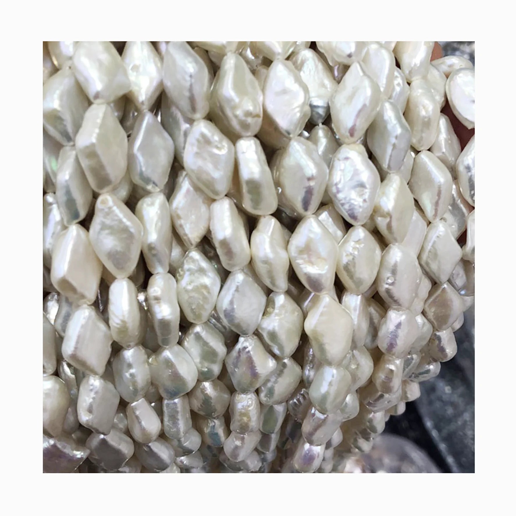 Wholesales Price 16 Inch 10 X 15 mm Diamond Shape Baroque Loose Freshwater Pearl in Strand .