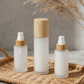 Cosmetic Eco-Friendly Frosted Glass Lotion Bottle with Bamboo Pump Cap for Skincare Cosmetic Packaging