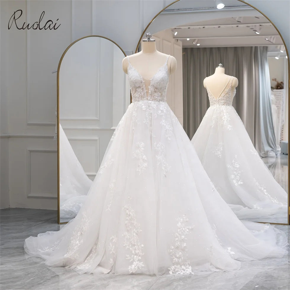 Ruolai QW01712 A-line Spaghetti Strap Deep V-Neck Low V-Back Applique Sequined White Wedding Dress
