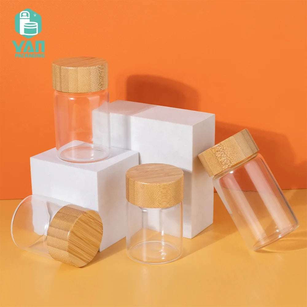 YAN Packaging 50ml 60ml 80ml 100ml Empty clear Food Glass Vial Containers for Powder Bamboo Lid Sensitive Pads