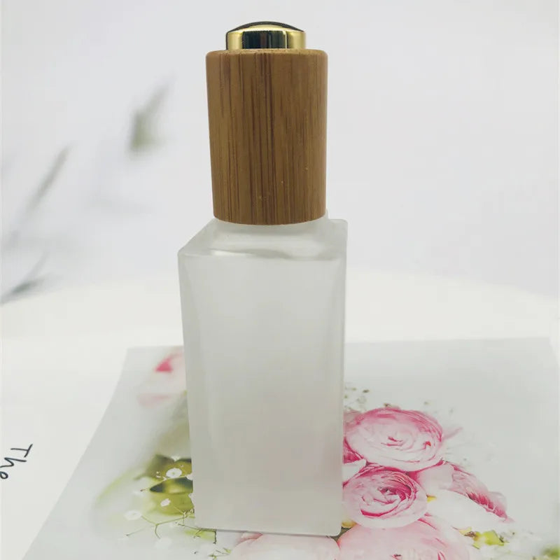 Skin Care Packaging Frosted Push Button Flat Shoulder Essential Oil Glass Dropper Bottle with Bamboo Cap