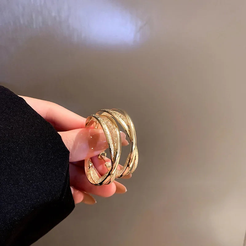 2025 Crystal wholesale fashion big twist gold plated stainless steel hoop earrings