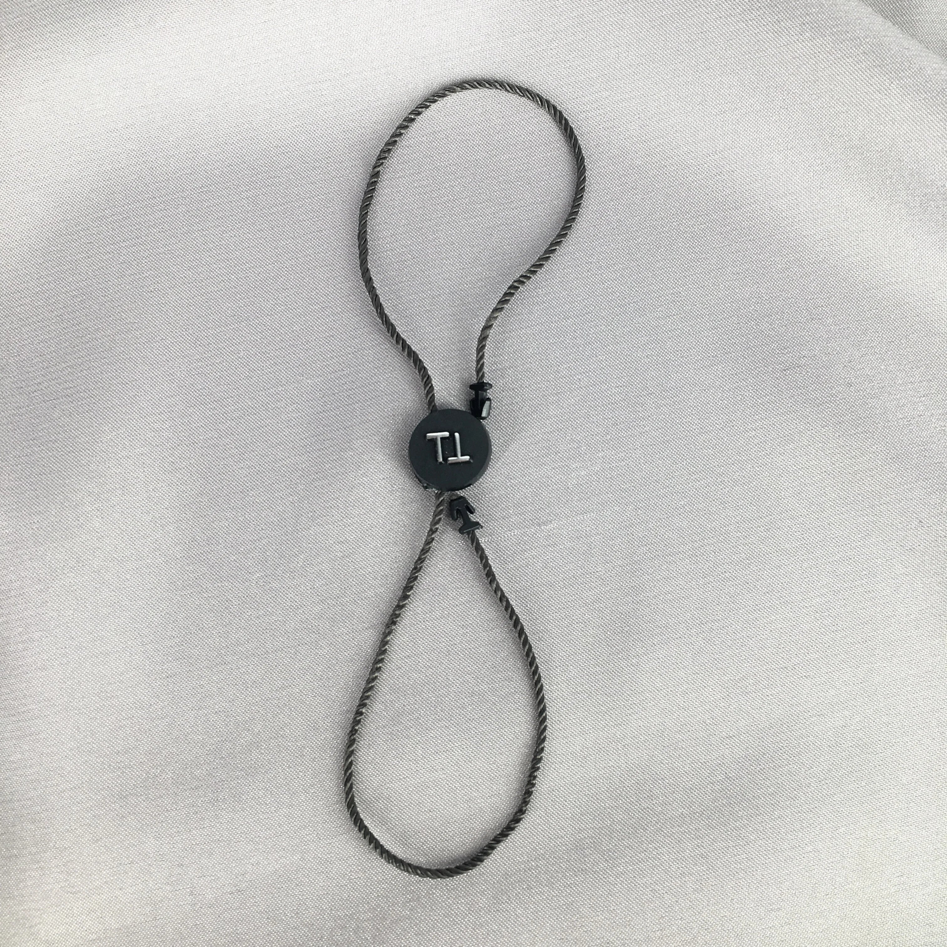 Custom Embossed Sliver logo Black Security Plastic Seal String hang Tag Fastener Seal Tag for Clothes