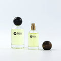 OEM Factory Price Wholesale Empty Cylinder Perfume Bottles 50ml 100ml Glass Wood Lid Eco-friendly Durable Hot Stamping