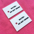 Promotional Custom Raised logo 3D Rubber Tag With Holes3mm Thickness Rubber Plastic Label for Apparel