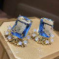 Huitan Charming Gold Plated CZ Earrings for Women Fashion Geometric Design Blue Crystal Zircon Engagement Pendant Earrings OEM