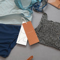 Customized Brown Swing Hang Tags for Clothing UV-Coated Cardboard Paper with Die Cut Logo Price Tag Designs for Swimwear Bags