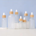 5-100ml Frosted Clear Glass Essential Oil Bottle Natural Bamboo Cap White Silicone Dropper for Skin Care Cream Packed Carton