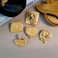 Wholesale Europe Cupid  Ancient Rome Foreign Trade New Creative Retro Egypt Embossed Cupid Matte Gold Soft Lapel Pin Badge