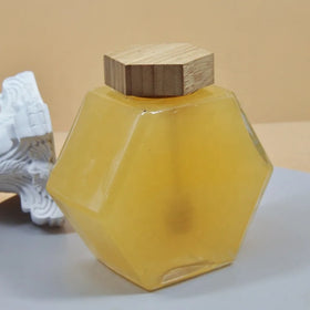 Wholesale Hexagonal Glass Storage Honey Bottle with Wooden Dipper and Lid