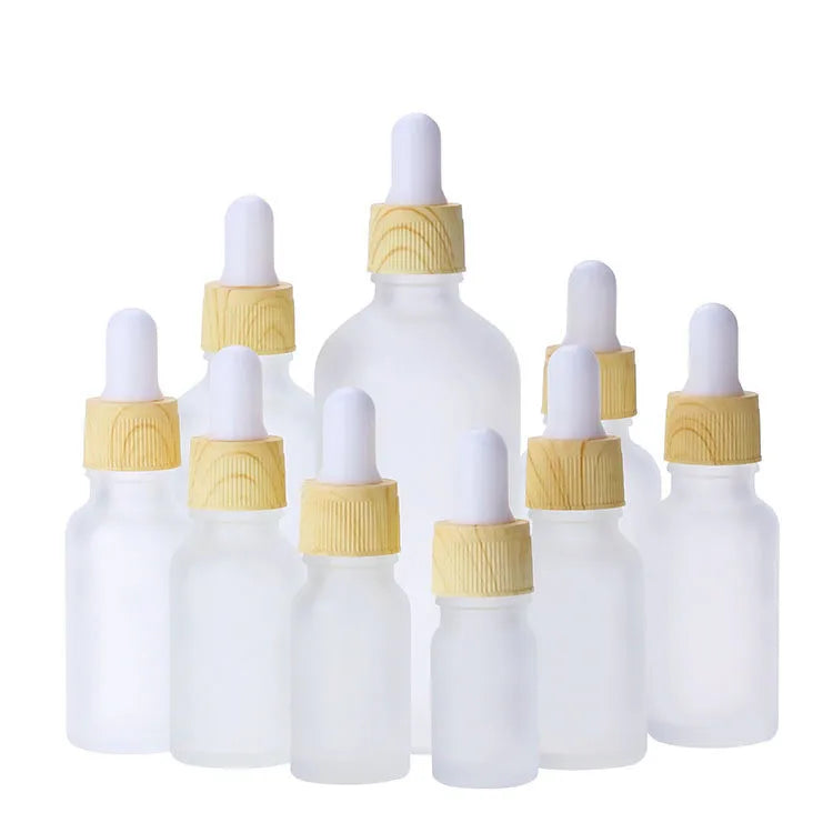 5ml 10ml 15ml 20ml 30ml 50ml 100ml Froested White Essential Oil Dropper Glass Bottle With Wood Grain Lid