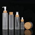 Eco Friendly 120ml Cylindrical Flat Shoulder Liquid Foundation Bottle Frosted Glass Spray Empty Lotion Bottle With Bamboo Pump