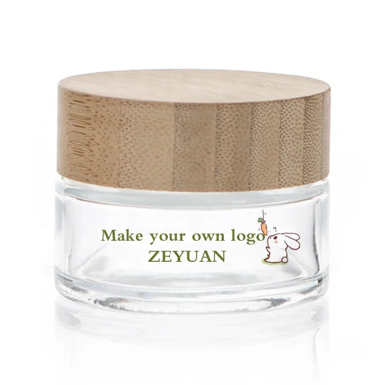 China Factory Custom Logo 50g Empty Clear Round Glass Jars With Bamboo Lids Refillable Cosmetic Glass Jars for Face Cream