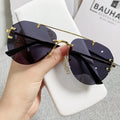SKYWAY Hot Selling UV400 Metal Frame Women's Sunglasses Fashion Frameless Sunscreen Shades with UV Protection PC Lenses
