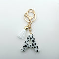 Wholesale Spot 26 Black and White Letters Cow Pattern White Tassel Resin Keychain for Bag Pendant