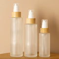 High Quality Wholesale 30ml Square Glass Lotion Spray Bottle Bamboo Pump Mist Spray 50ml 100ml 10ml Sizes Skin Care Serum