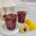 The Glass Jar With Dried Lemon Slices and Gelatin Candles for Home Decoration