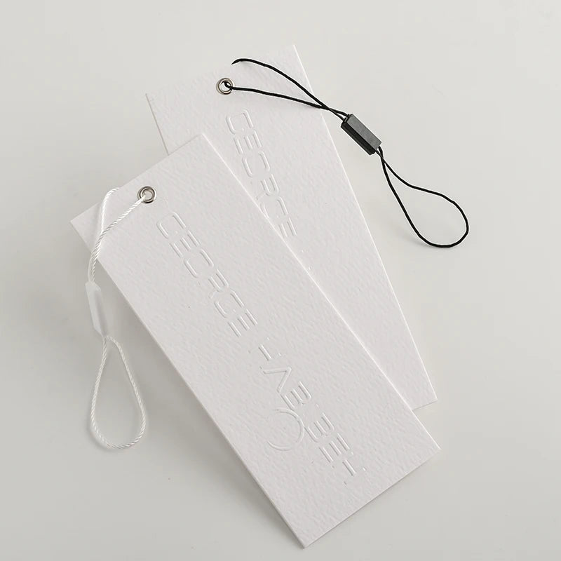 Luxury Swing Paper Embossed hang Tags With Steel Ring Eyelet Custom Seal Tag With Rope Fashion Embossed hang Tag String