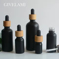 Wholesale 5ml 15ml 30ml 50ml 100ml  Matte Black Glass Essential Oil Serum Dropper Bottles With Bamboo Wooden Lid for Skincare