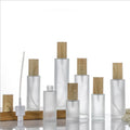 20ml-120ml Customized Glass Lotion Bottle With Frosted Spray Pump Head With Wooden Grain Cap