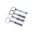 Wholesale Metal Car Shock Absorber Keychain with Turbo Spring Design UV Offset Silk Screen Enamel Printing for Gift Giving