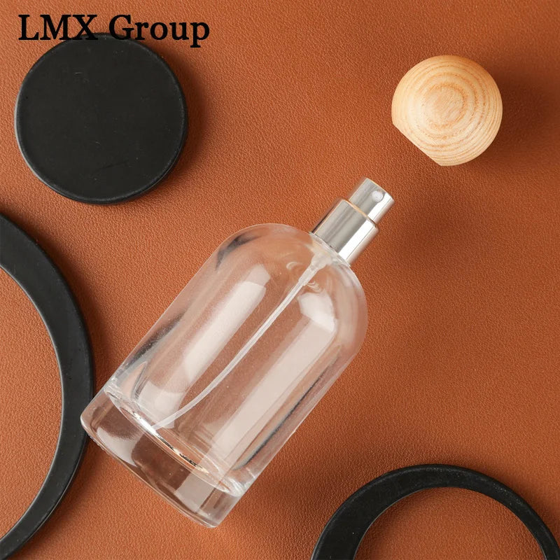 Luxury Vintage Cylinder Spray Glass Perfume Bottle 30ml 50ml 100ml Refillable Design with Round Wooden Lids and Pump Sprayer