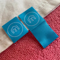 Ultrasonic Cut High Density Bottom Hem Labelcomfortable Book Cover Fold Sleeve Hem Tag for Apparel MegaBDM