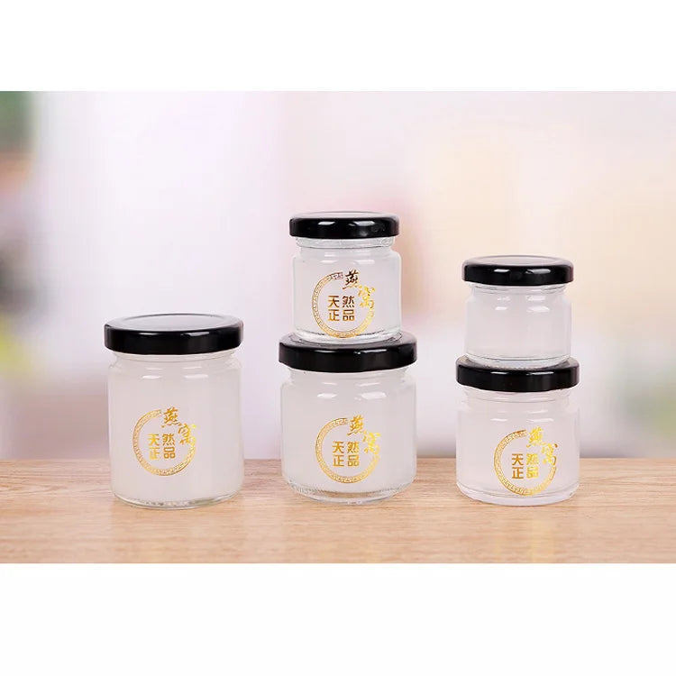 Hot Sale 50ml 100ml 150ml 200ml 300ml 500ml Round Glass Honey Pickle Jars Tin Lid Eco-friendly Recyclable Freshness Preservation